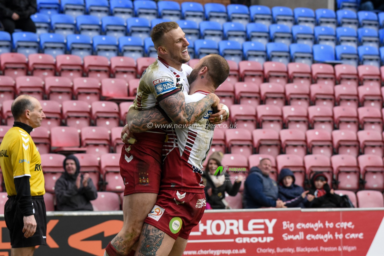 23rd February 2020, DW Stadium, Wigan, England; Betfred Super League, Wigan Warriors v Hull FC : Dom Manfredi (21) of Wigan Warriors celebrates scoring a try with Zak Hardaker (1) of Wigan Warriors