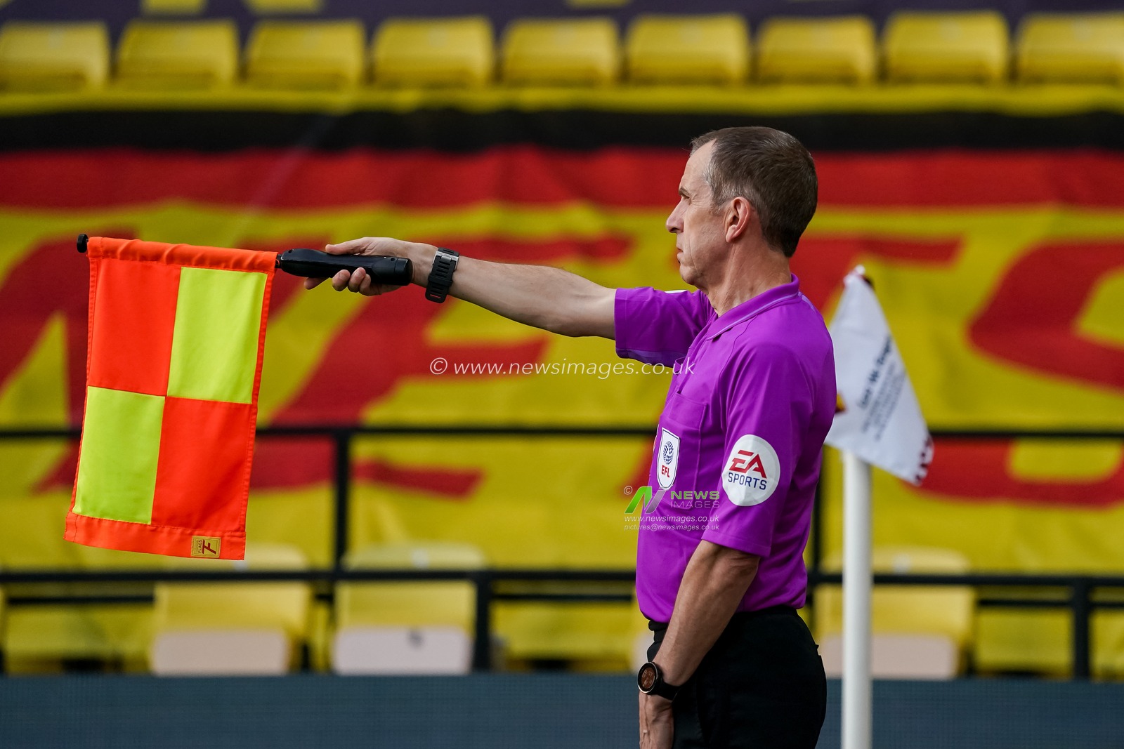 Assistant Referee Derek Eaton signals for offside