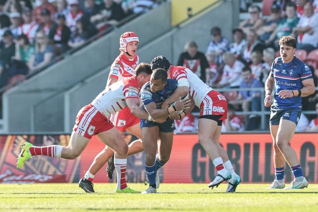 Corey Hall of Wakefield Trinity is tackled by Jonny Lomax of St Helens R.F.C. during the Betfred Super League round 9 match St Helens vs Wakefield Trinity at The BrewDog Stadium, St Helens, United Kingdom on 25 April 2026

(Photo by Mark Cosgrove/News Images)