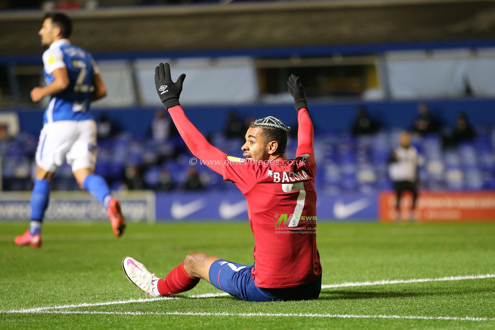 Juninho Bacuna (7) of Huddersfield Town pleads with the linesman for a foul