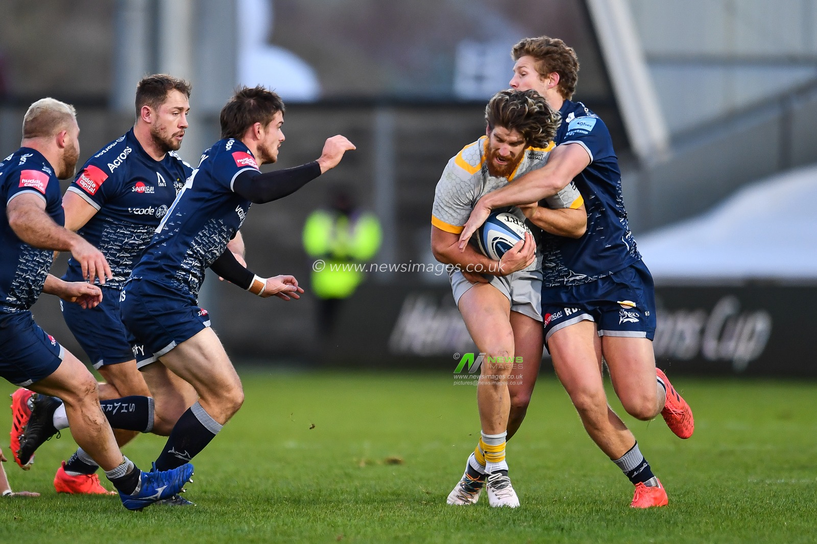 Michael Le Bourgeois of Wasps is tackled by Rohan Janse van Rensburg of Sale Sharks