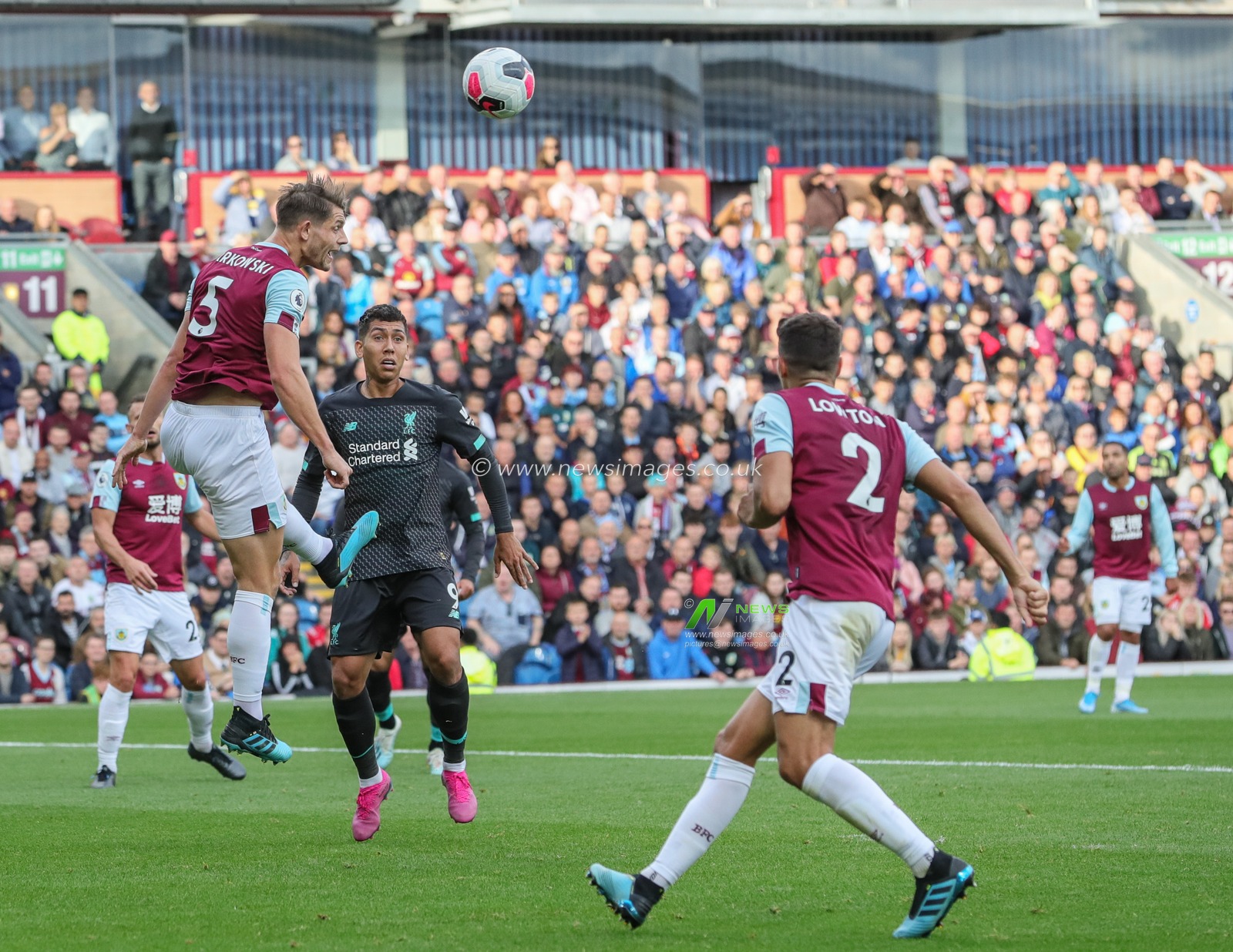31st August 2019, Turf Moor, Burnley, England ; Premier League Football, Burnley vs Liverpool : James Tarkowski (5) of Burnley heads clear 

Credit: Mark Cosgrove/News Images

English Football League images are subject to DataCo Licence