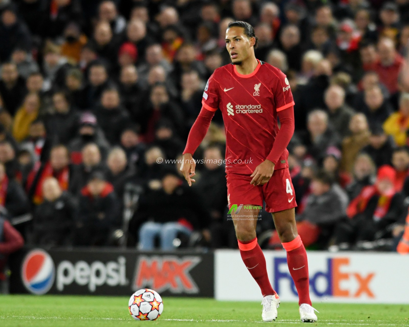 Virgil van Dijk #4 of Liverpool with the ball