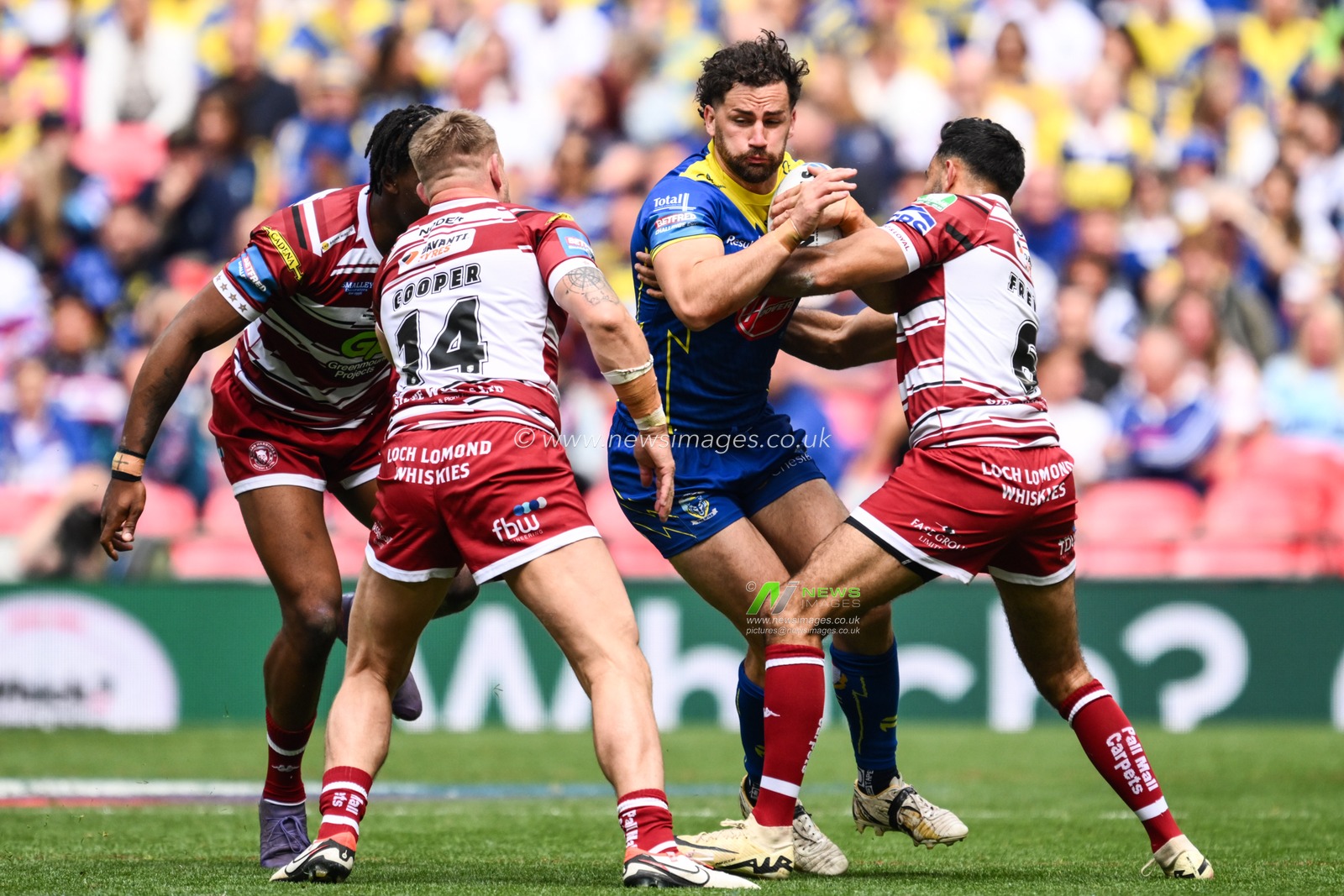 Toby King of Warrington Wolves is tackled by Bevan French of Wigan Warriors during the Betfred Challenge Cup Final match Warrington Wolves vs Wigan Warriors at Wembley Stadium, London, United Kingdom, 8th June 2024

(Photo by Craig Thomas/News Images)