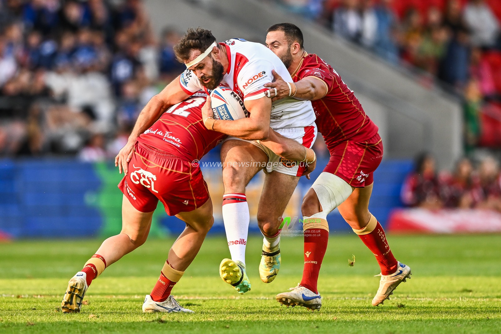 Alex Walmsley #8 of St Helens is tackled by Paul Seguier #12 of Catalans Dragons during the Betfred Super League Round 19 match St Helens vs Catalans Dragons at Totally Wicked Stadium, St Helens, United Kingdom, 13th July 2023

(Photo by Craig Thomas/News Images)