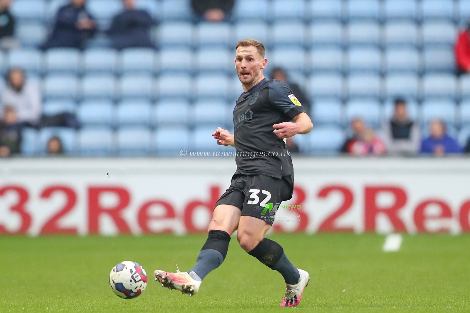 Tom Lees #32 of Huddersfield Town passes the ball during the Sky Bet Championship match Coventry City vs Huddersfield Town at Coventry Building Society Arena, Coventry, United Kingdom, 28th January 2023

(Photo by Gareth Evans/News Images)