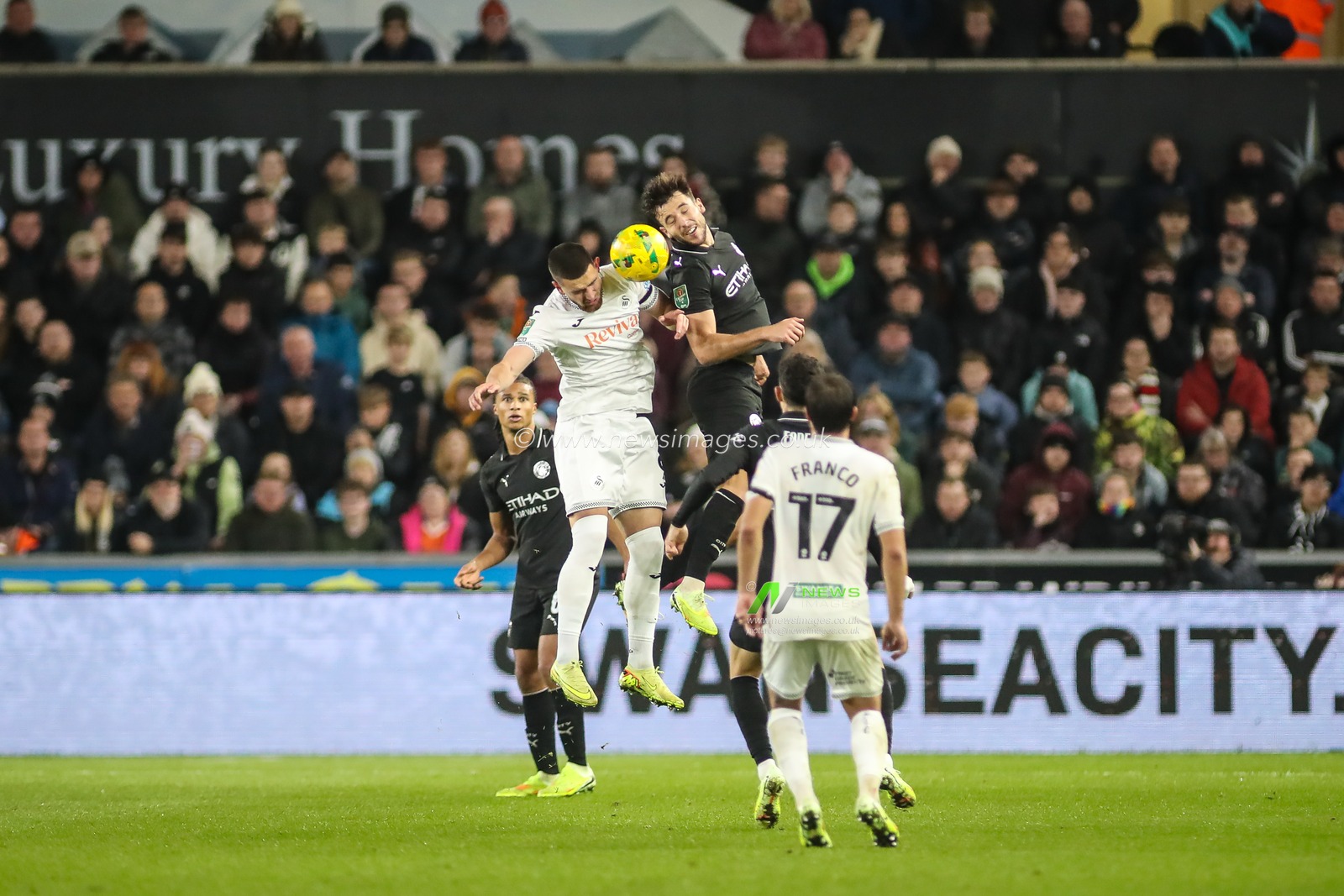 Nico González of Manchester City and Žan Vipotnik of Swansea City compete for the ball during the Carabao Cup Last 16 Swansea City vs Manchester City at Swansea.com Stadium, Swansea, United Kingdom, 29th October 2025

(Photo by Andrew Lewis/News Images)

*** GER AUT SUI OUT ***