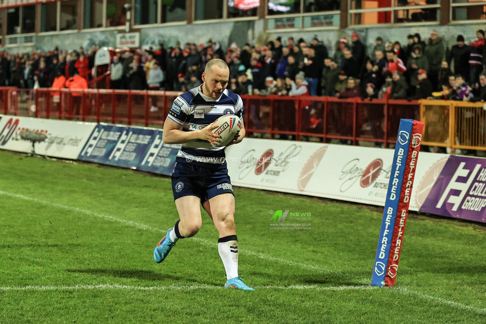 Liam Marshall #5 of Wigan Warriors goes over with a 60 yard solo try