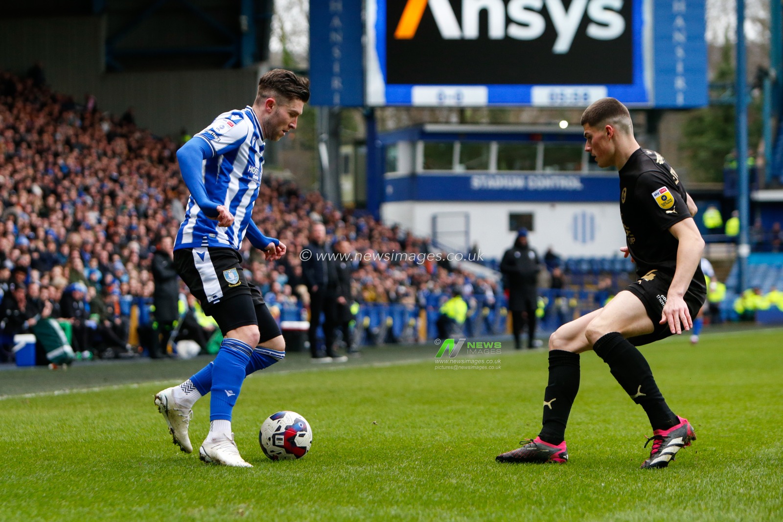 Josh Windass #11 of Sheffield Wednesday and Ronnie Edwards #4 of Peterborough United during the Sky Bet League 1 match Sheffield Wednesday vs Peterborough at Hillsborough, Sheffield, United Kingdom, 4th March 2023

(Photo by Ben Early/News Images)