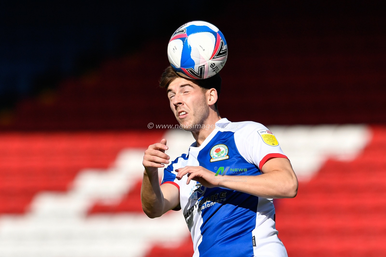 Joe Rankin-Costello (24) of Blackburn Rovers heads the ball