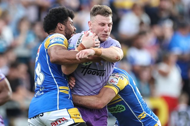 George Williams of Warrington Wolves is tackled by Kallum Watkins of Leeds Rhinos during the Betfred Super League Round 14 Leeds Rhinos v Warrington Wolves at Headingley Stadium, Leeds, United Kingdom, 14th June 2025

(Photo by Mark Cosgrove/News Images)