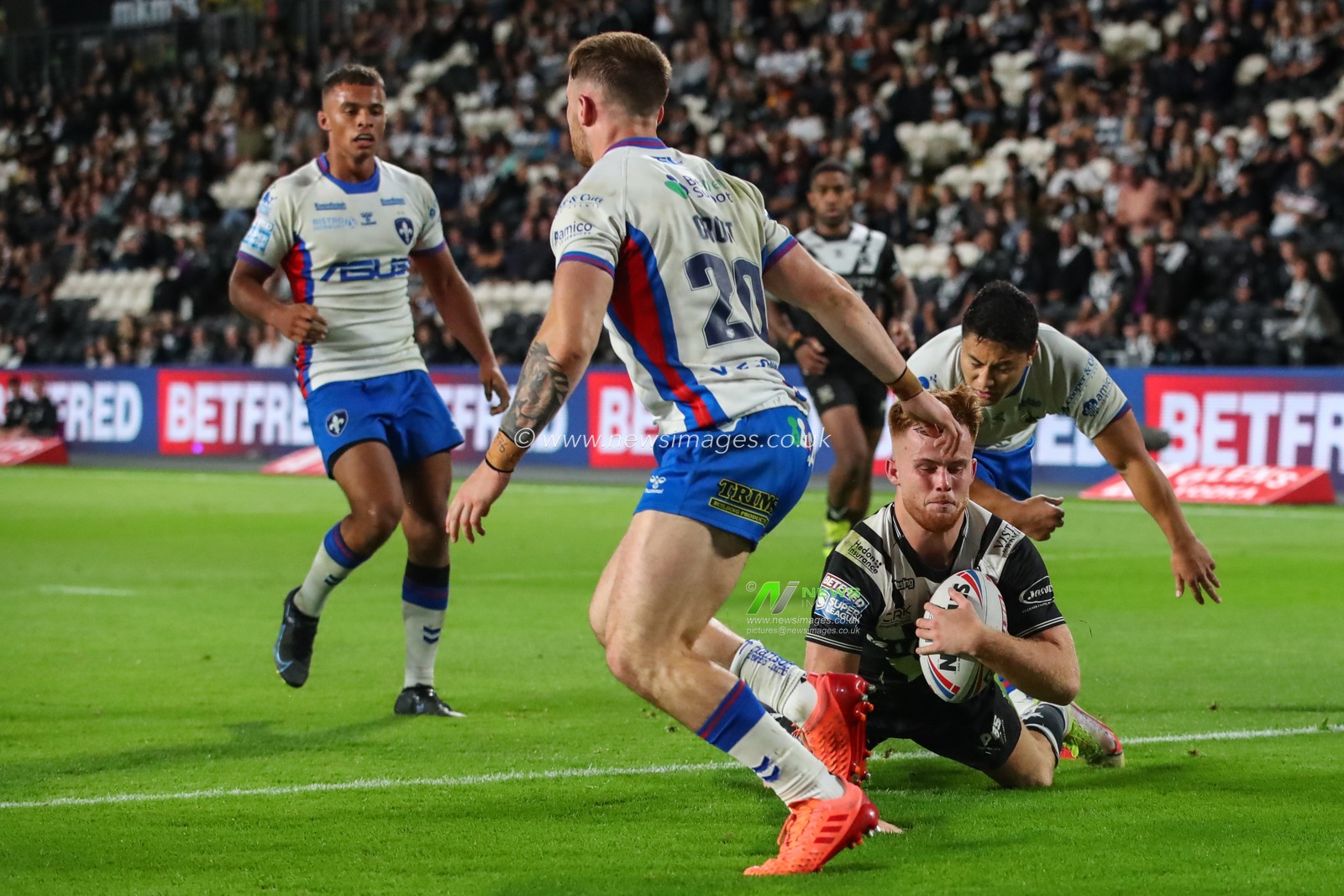 Ellis Longstaff #38 of Hull FC goes over for a try late in the second half