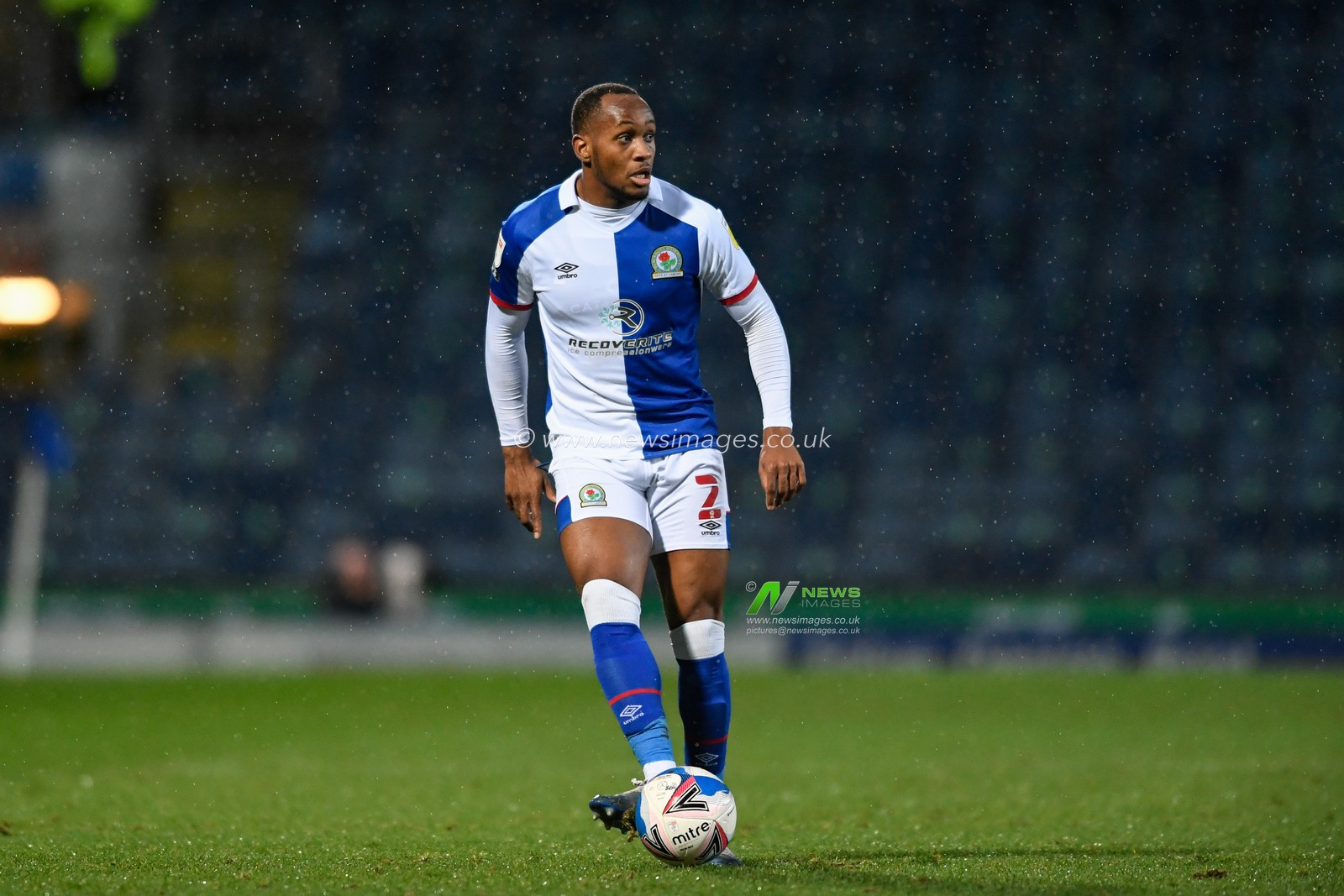Ryan Nyambe #2 of Blackburn Rovers looks for a passing option