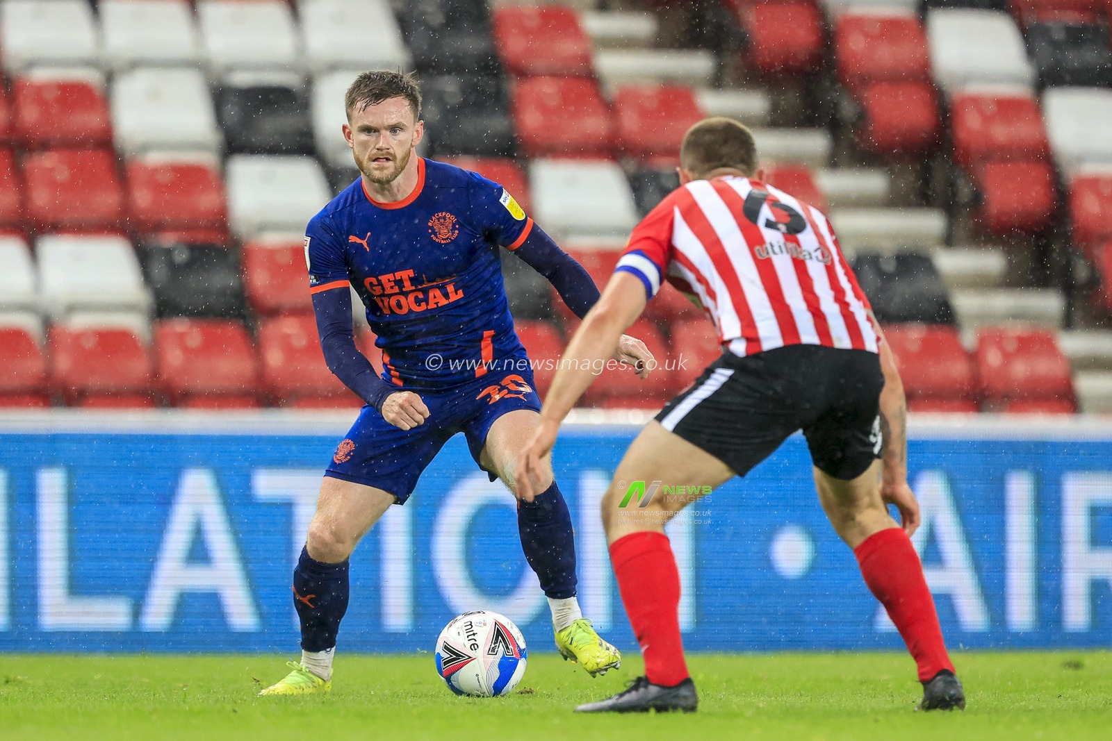 Oliver Turton #20 of Blackpool takes on Max Power #6 of Sunderland
