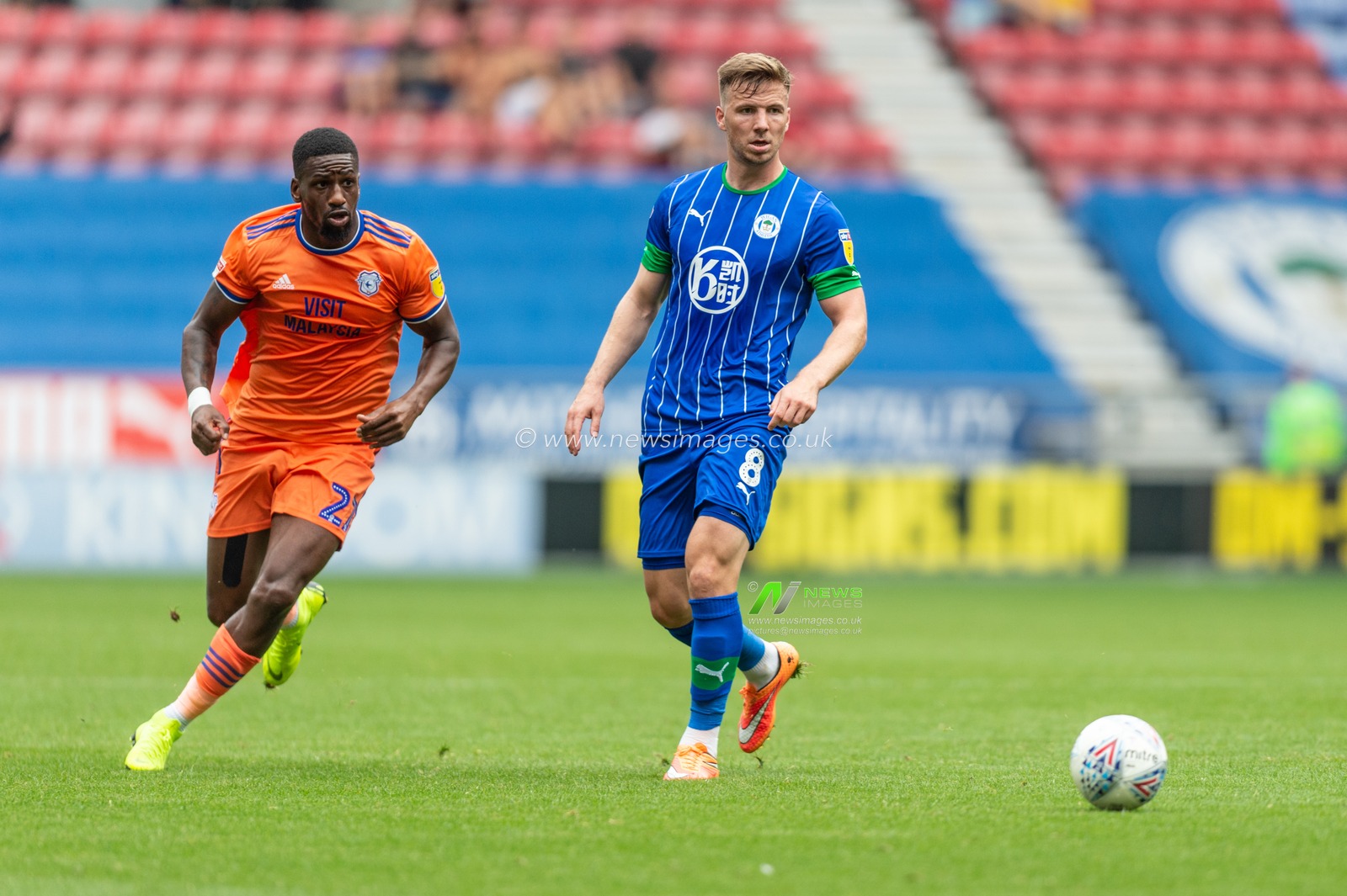 3rd August 2019, DW Stadium, Wigan, England; Sky Bet Championship, Wigan Athletic vs Cardiff City ; Ashley Richards (21) of Cardiff City and Lee Evans (8) of Wigan Athletic chase down the ball during the game


Credit: Richard Long/News Images

English Football League images are subject to DataCo Licence