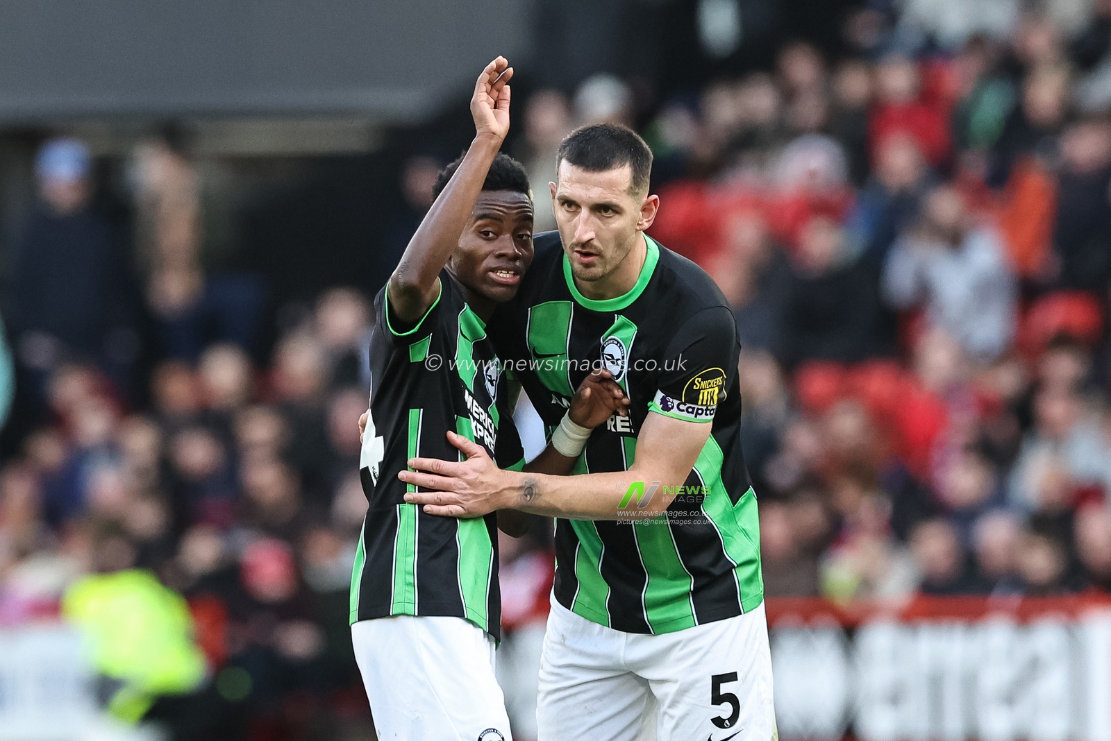 Simon Adingra of Brighton & Hove Albion speaks to Lewis Dunk of Brighton & Hove Albion during the Premier League match Sheffield United vs Brighton and Hove Albion at Bramall Lane, Sheffield, United Kingdom, 18th February 2024

(Photo by Mark Cosgrove/News Images)