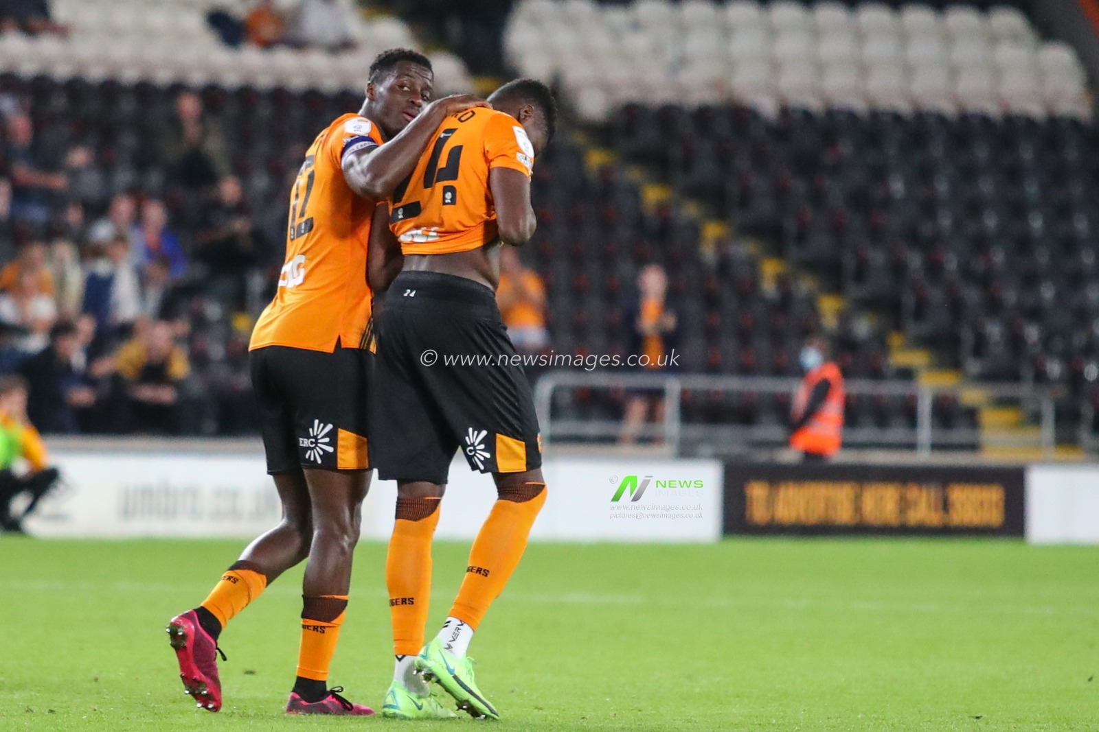 Di'Shon Bernard #24 of Hull City after missing his penalty is consoled by Josh Emmanuel #12 of Hull City