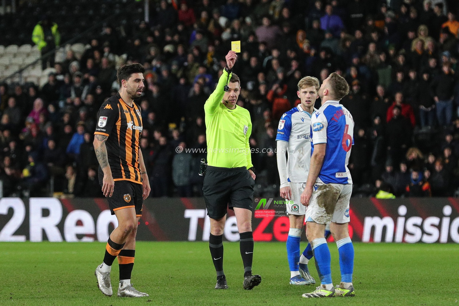Referee Matthew Donohue awards a yellow card to Sondre Tronstad during the Sky Bet Championship match Hull City vs Blackburn Rovers at MKM Stadium, Hull, United Kingdom, 29th December 2023

(Photo by James Heaton/News Images)