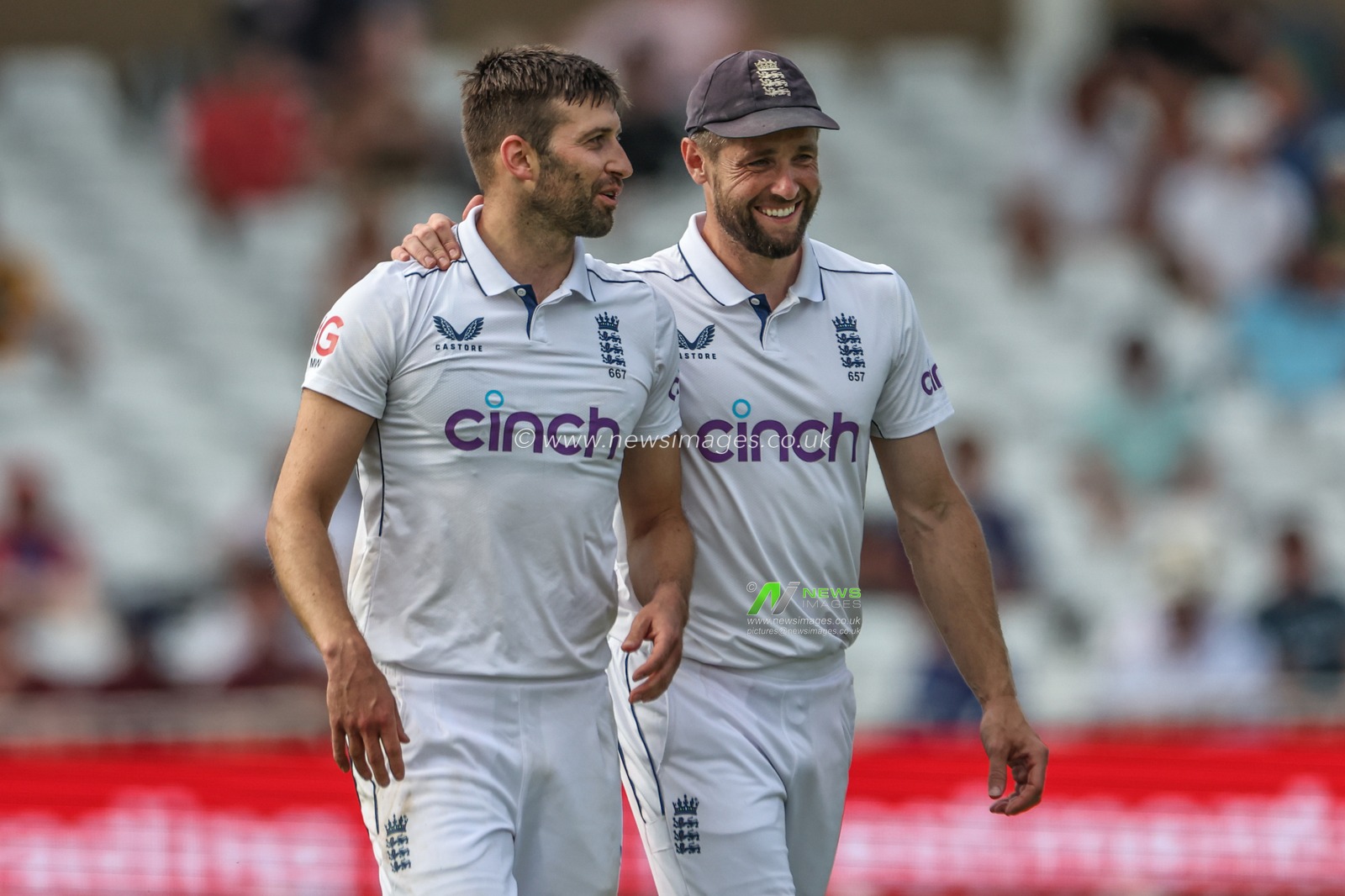 Chris Woakes of England puts his arm around Mark Wood of England as they laugh during the Rothesay Test Match day four match England vs West Indies at Trent Bridge, Nottingham, United Kingdom, 21st July 2024

(Photo by Mark Cosgrove/News Images)