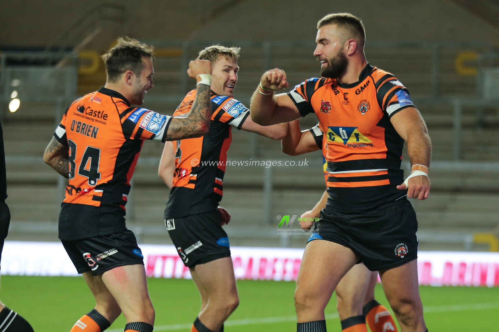 Mike McMeeken (12) of Castleford Tigers celebrates scoring his try with team mate Gareth Oâ€™Brien.