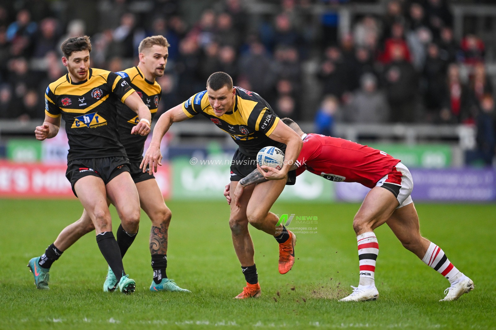 Innes Senior of Castleford Tigers is tackled by Cade Cust of Salford Red Devils during the Betfred Super League match Salford Red Devils vs Castleford Tigers at Salford Community Stadium, Eccles, United Kingdom, 25th February 2024

(Photo by Craig Thomas/News Images)