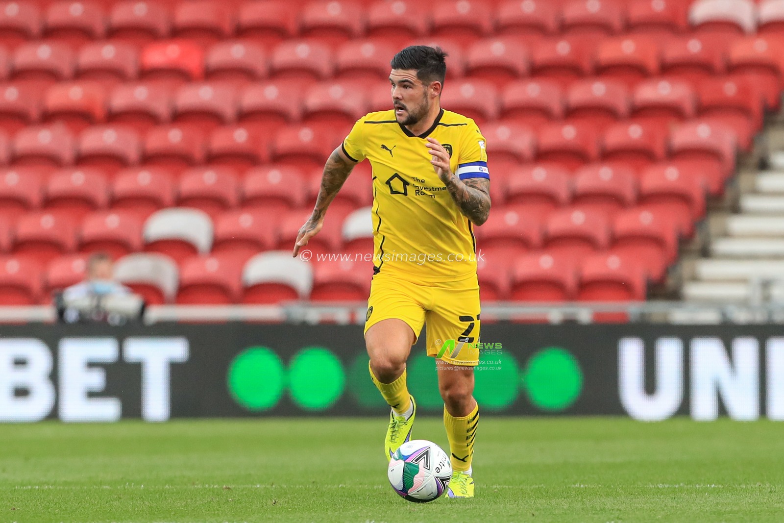 Alex Mowatt (captain) (27) of Barnsley in action during the game