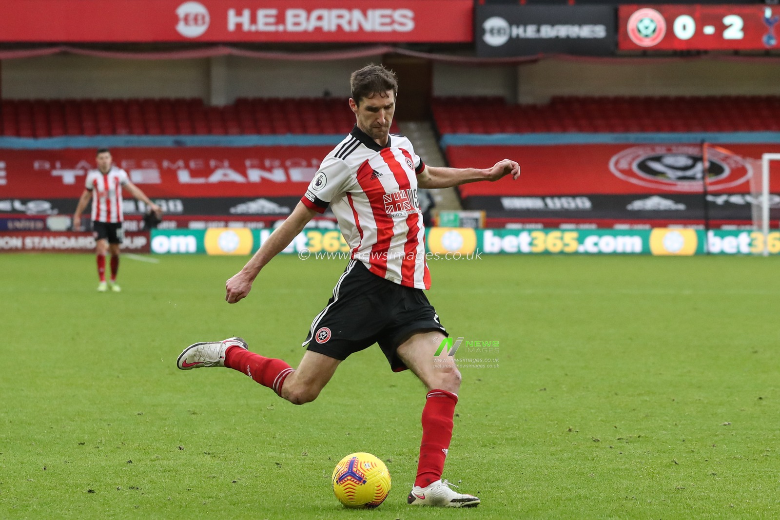 Chris Basham #6 of Sheffield United crosses the ball