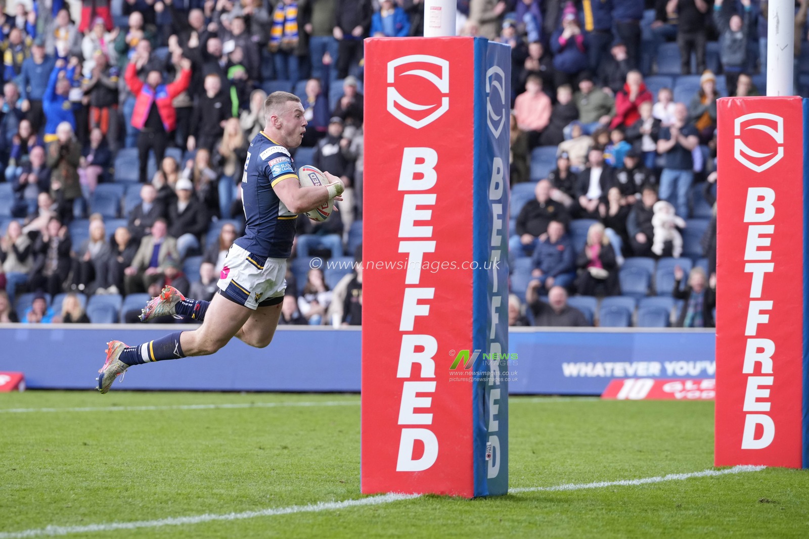 Harry Newman #3 of Leeds Rhinos dives over to score a try during the Betfred Super League Round 6 match Leeds Rhinos vs Catalans Dragons at Headingley Stadium, Leeds, United Kingdom, 25th March 2023

(Photo by Steve Flynn/News Images)