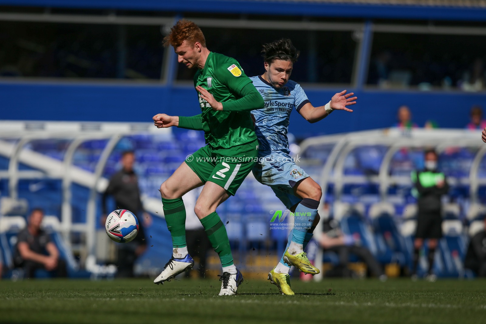 Callum OHare #11 of Coventry City and Sepp van den Berg #2 of Preston North End compete for the ball