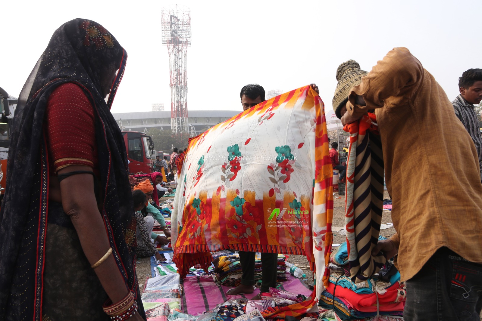 Pilgrims buy sharee at a transit camp on the way to Gangasagar in Kolkata, India, on Thursday, January 9, 2025.Thousands of Hindu pilgrims are expected to take the annual holy dip at Gangasagar, where the Ganges River meets the Bay of Bengal, on the auspicious Makar Sankranti festival day on January 14.Pictures by Debajyoti Chakraborty.(Photo: Debajyoti Chakraborty/News Images)