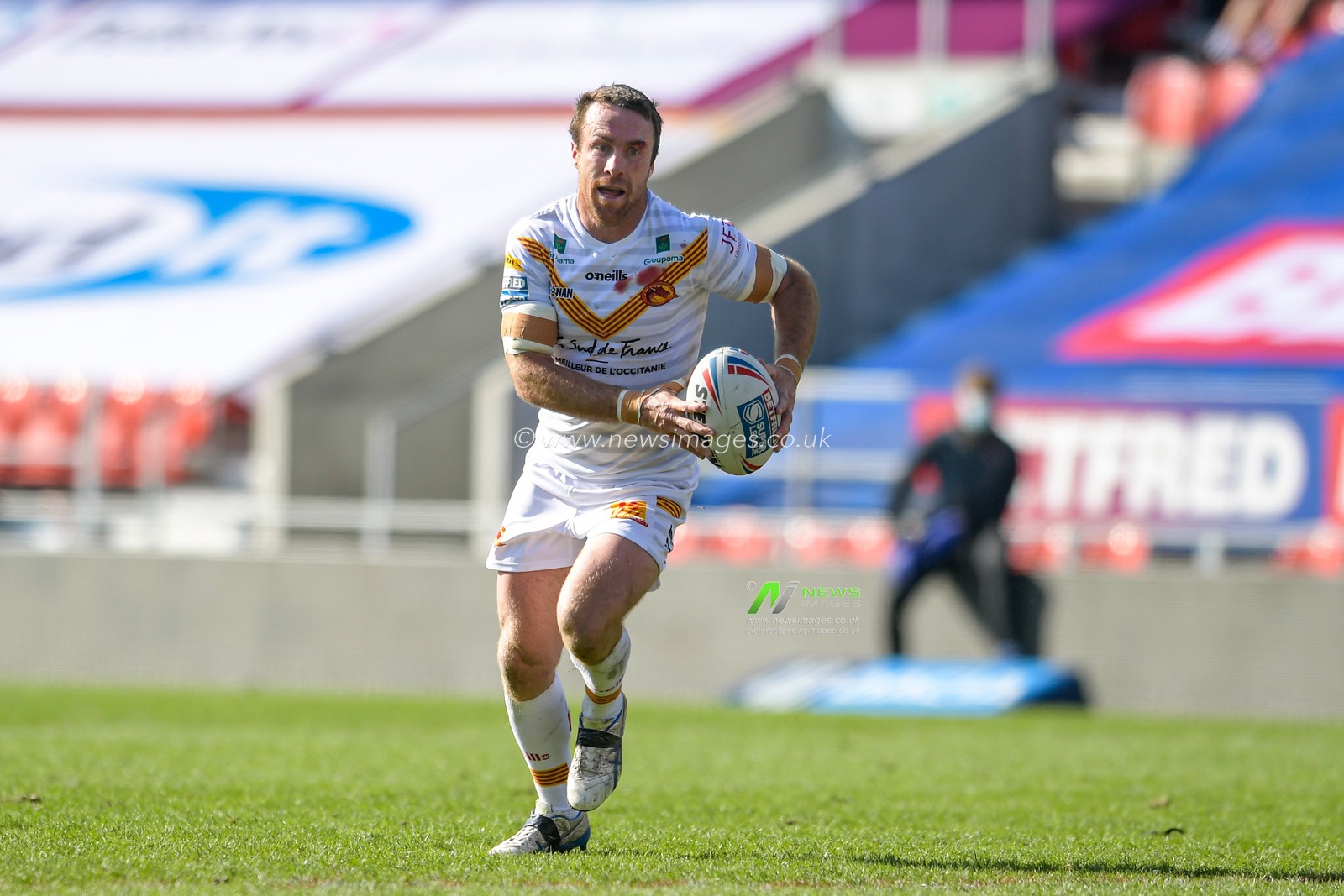 James Maloney (6) of Catalans Dragons runs forward with the ball