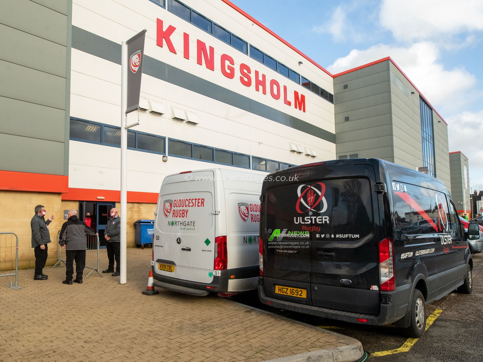 Team vans sit outsidev Kingsholm Stadium before kick off