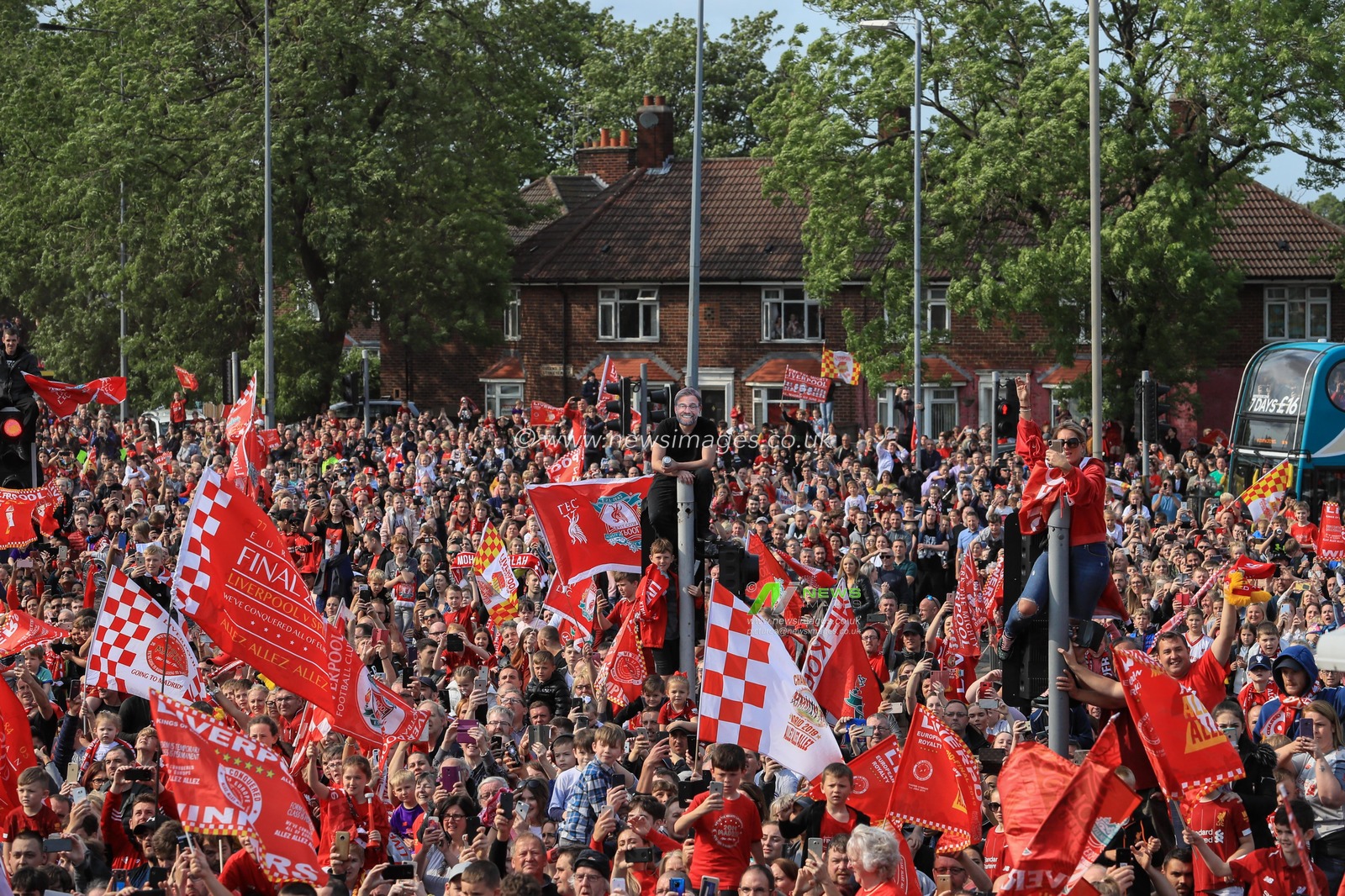 2nd June 2019 , Liverpool, England; UEFA Champions League, Liverpool FC Champions League winners celebrations and open top bus parade ; Liverpool fans line the streets to welcome home their heroes after winning the European Cup for the sixth time 

Credit: Mark Cosgrove/News Images