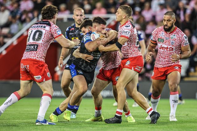 James Bentley of Leeds Rhinos is tackled during the Betfred Super League round 21 match Leigh Leopards vs Leeds Rhinos at Leigh Sports Village, Leigh, United Kingdom, 7th August 2025

(Photo by Alfie Cosgrove/News Images)