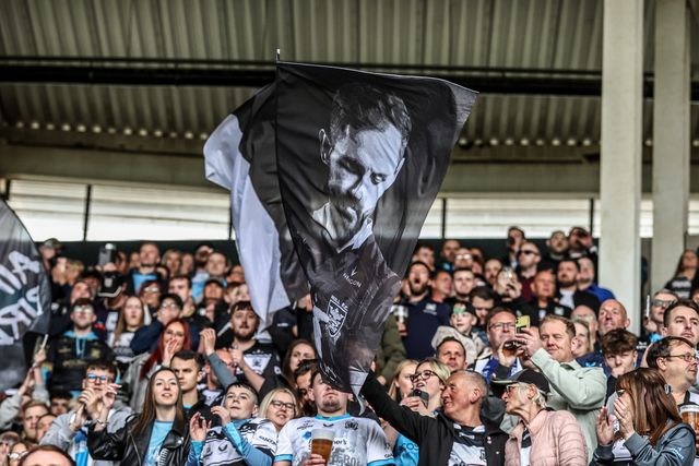Hull FC fans with flags during the Betfred Super League Round 8 match Hull FC vs Hull KR at MKM Stadium, Hull, United Kingdom, 18th April 2025

(Photo by Alfie Cosgrove/News Images)