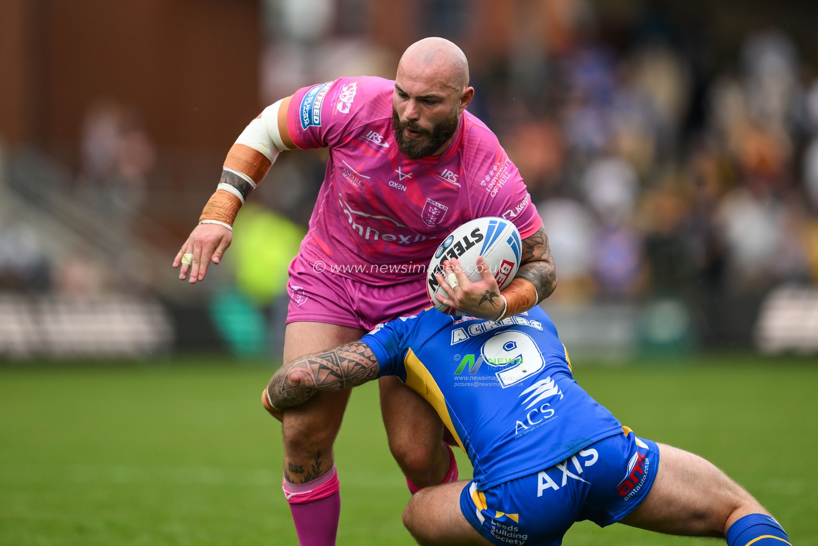 Sam Luckley of Hull KR is tackled by Andy Ackers of Leeds Rhinos  during the Betfred Super League Round 18 match Leeds Rhinos vs Hull KR at Headingley Stadium, Leeds, United Kingdom, 20th July 2024

(Photo by Craig Thomas/News Images)