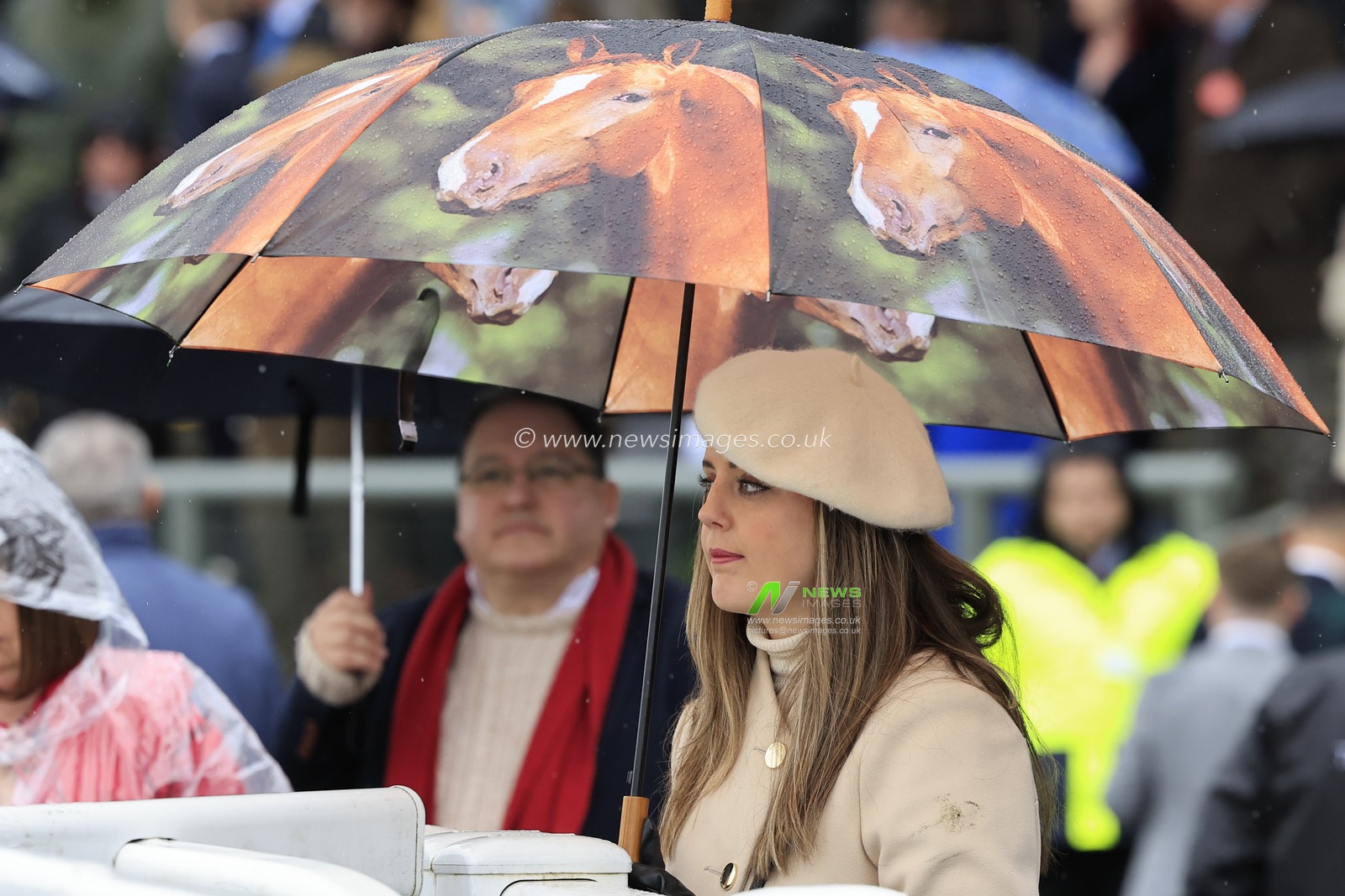 Racegoers sheltering from the rain during the Randox Grand National festival 2023 Ladies Day at Aintree Racecourse, Liverpool, United Kingdom, 14th April 2023

(Photo by Conor Molloy/News Images)