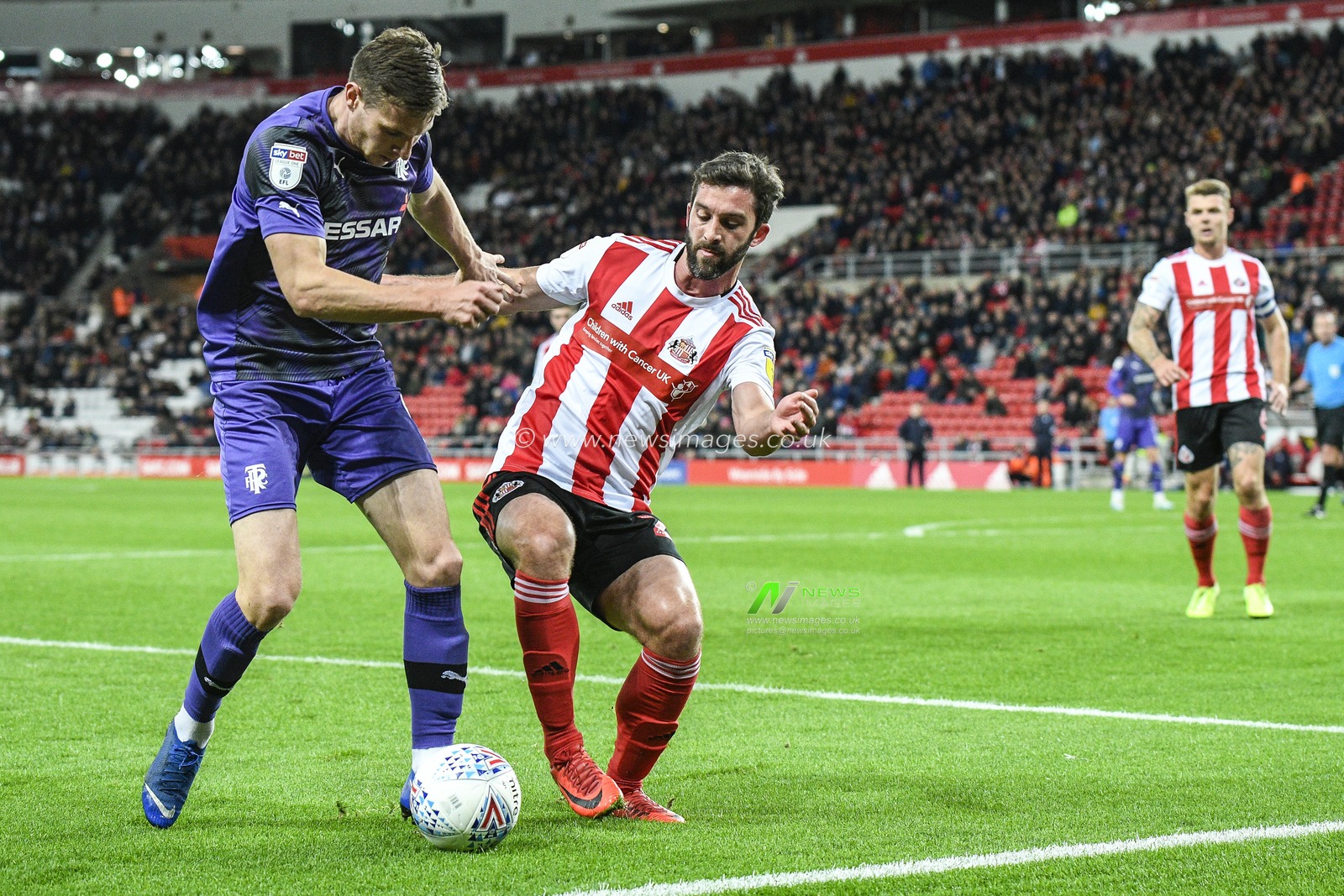 22nd October 2019, Stadium Of Light, Sunderland, England; Sky Bet League 1, Sunderland v Tranmere Rovers : Will Grigg of Sunderland tackles Paul Mullin of Tranmere Rovers

Credit: Iam Burn/News Images