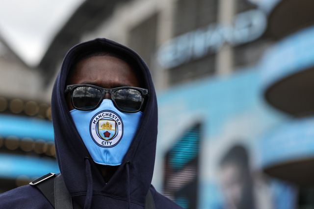 A Manchester City fan with a City face mask on during the Premier League match Manchester City vs Arsenal at Etihad Stadium, Manchester, United Kingdom on 19 April 2026

(Photo by Mark Cosgrove/News Images)