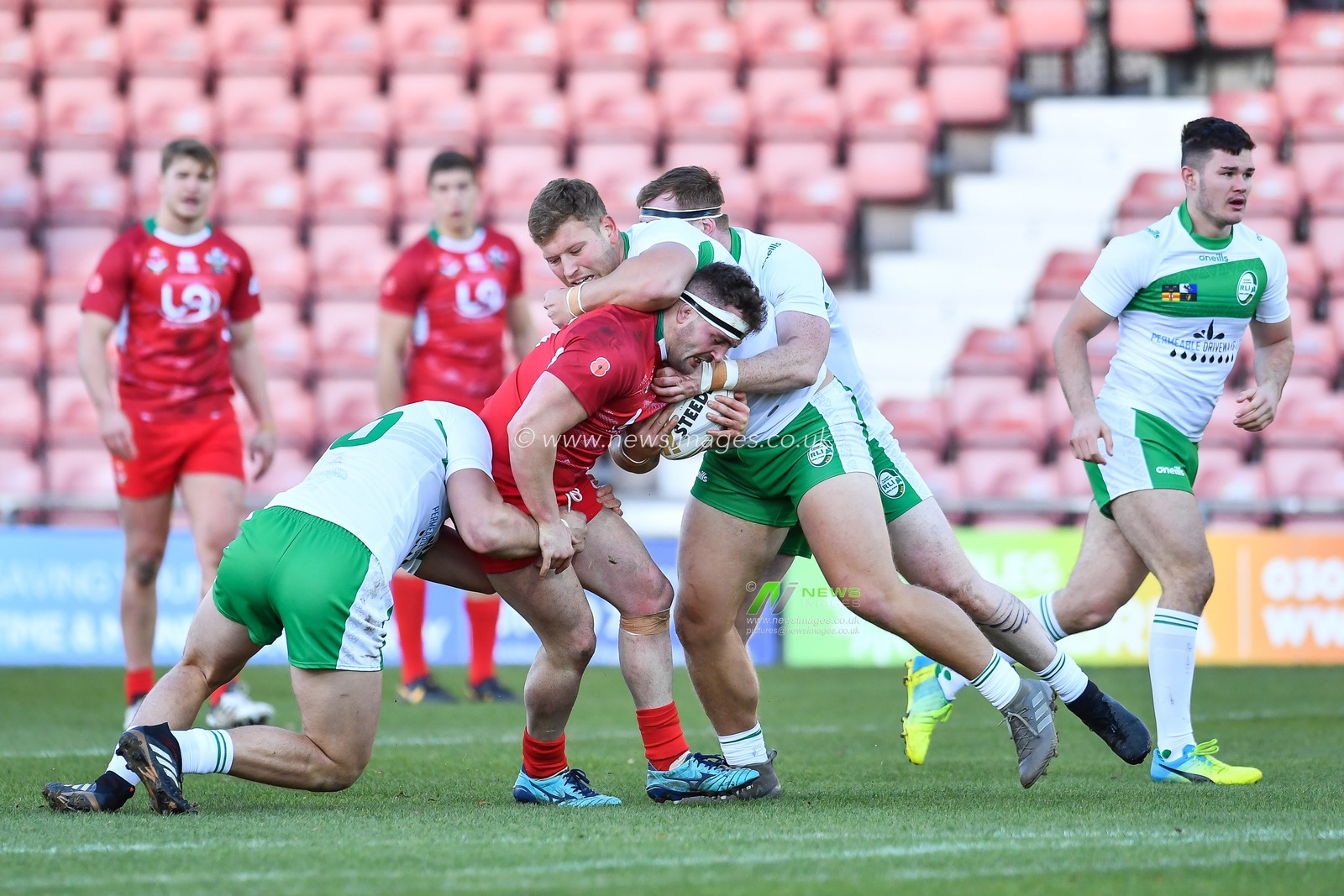 11th November 2018 , Racecourse Ground,  Wrexham, Wales ;  Rugby League World Cup Qualifier,Wales v Ireland ; Connor Davies of Wales is tackled by Liam Byrne of Ireland 


Credit:   Craig Thomas/News Images