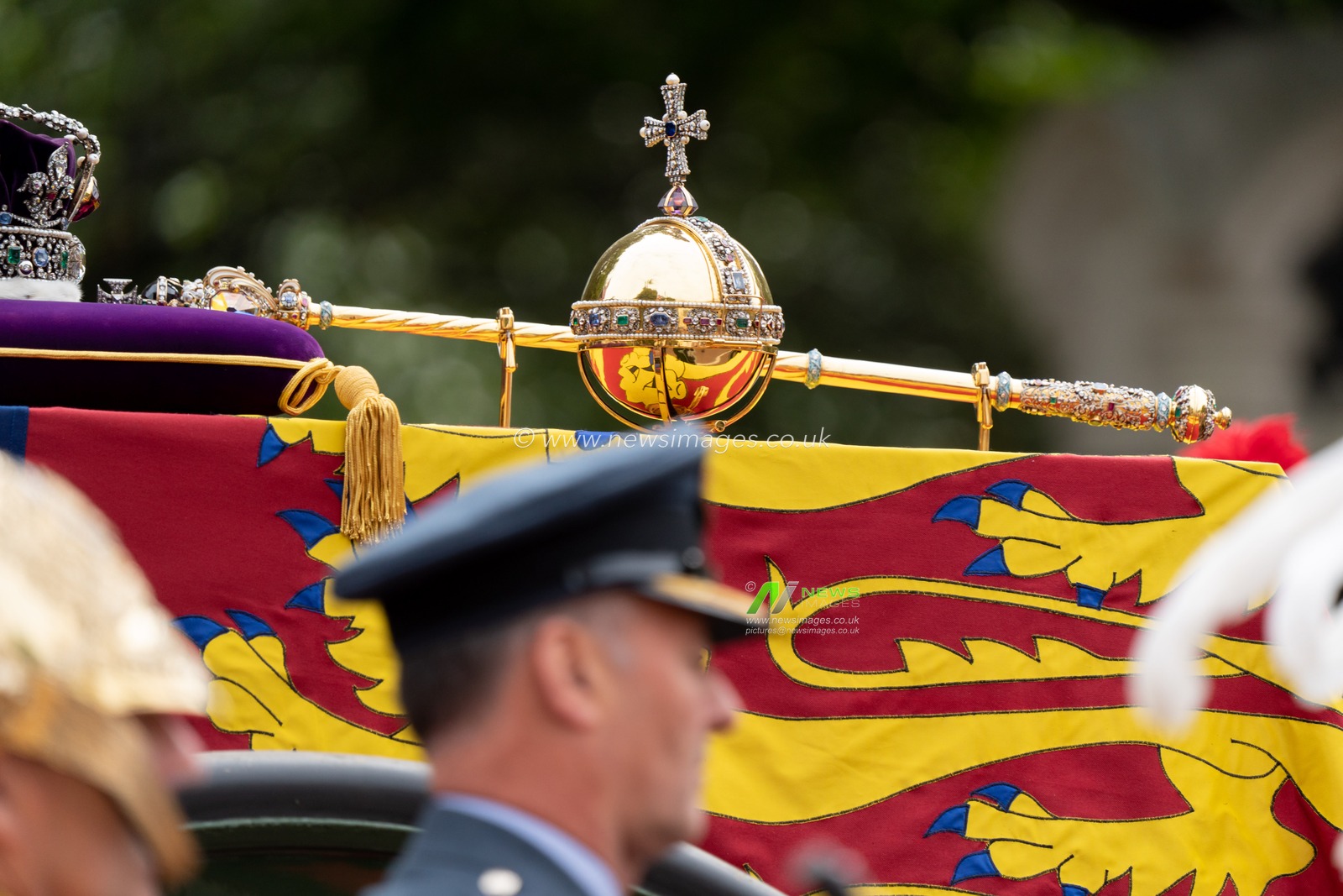 The Imperial Crown rests on the Royal Standard with the Orb and Sceptre on the the coffin of Queen Elizabeth 11 on a State Gun Carriage in the procession after the State Funeral at Westminster Abbey on the mall, in London City Centre, London, United Kingdom, 19th September 2022

(Photo by Richard Washbrooke/News Images)