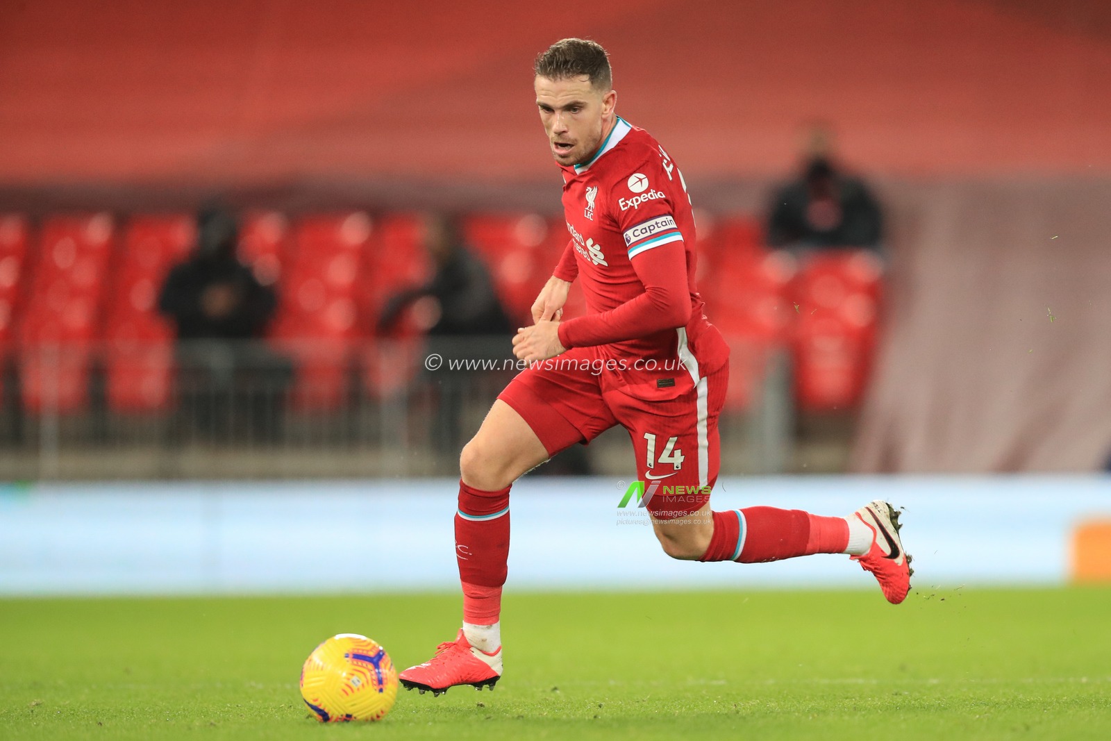 Jordan Henderson #14 of Liverpool in action during the game