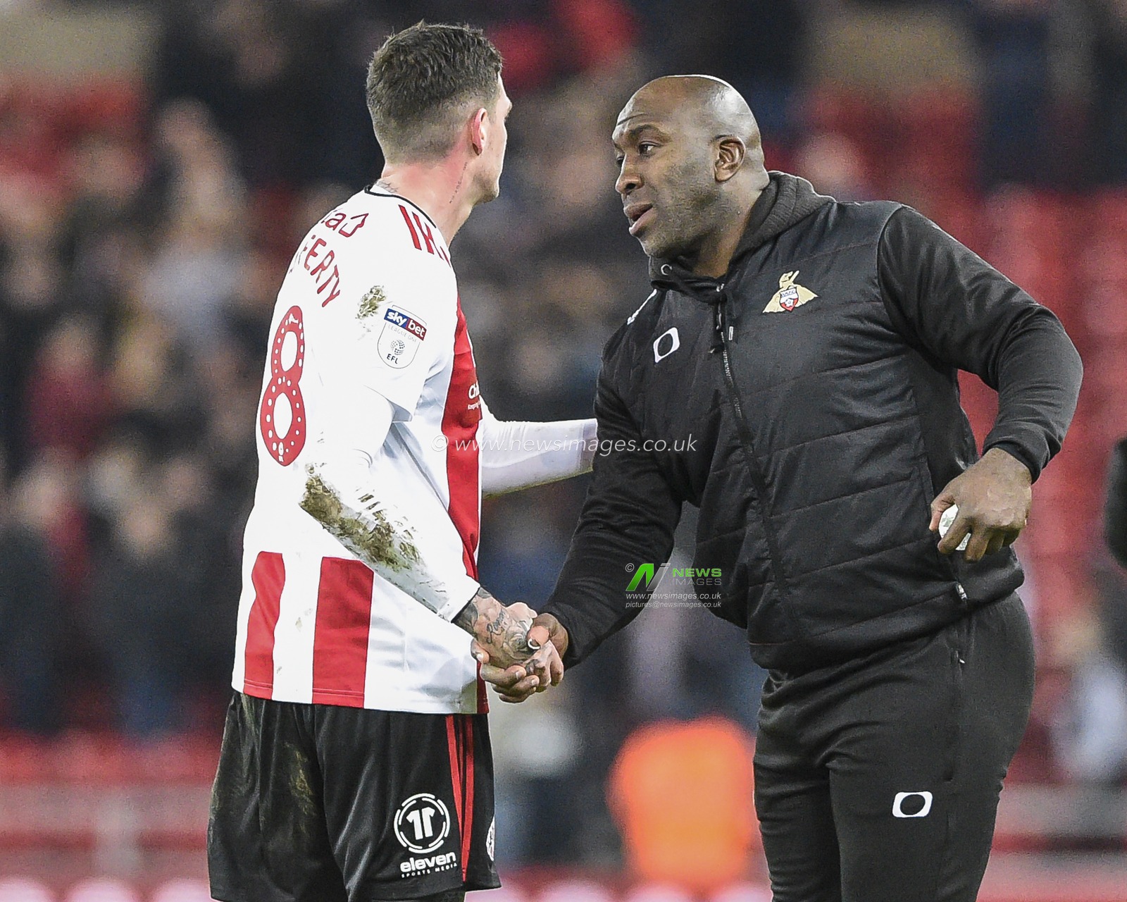 24th January 2020, Stadium Of Light, Sunderland, England; Sky Bet League 1, Sunderland v Doncaster Rovers : Darren Moore, manager of Doncaster Rovers shakes hands with Kyle Lafferty (8) of Sunderland after the match