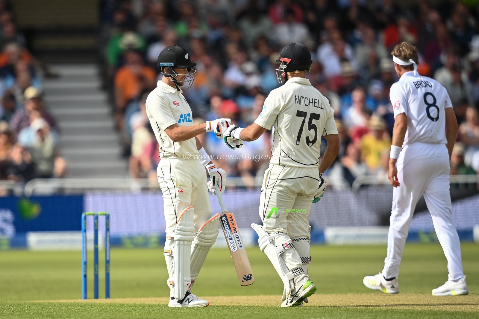 Trent Boult of New Zealand (L) andDaryl Mitchell of New Zealand (R) bump fishes after Mitchell hits a four during day 2 of the 2nd Test between the New Zealand Blackcaps and England at Trent Bridge Cricket Ground, Nottingham, England on Saturday 11 June 2022.
New Zealand tour of England 2022.
 Â© Craig Thomas / www.photosport.nz