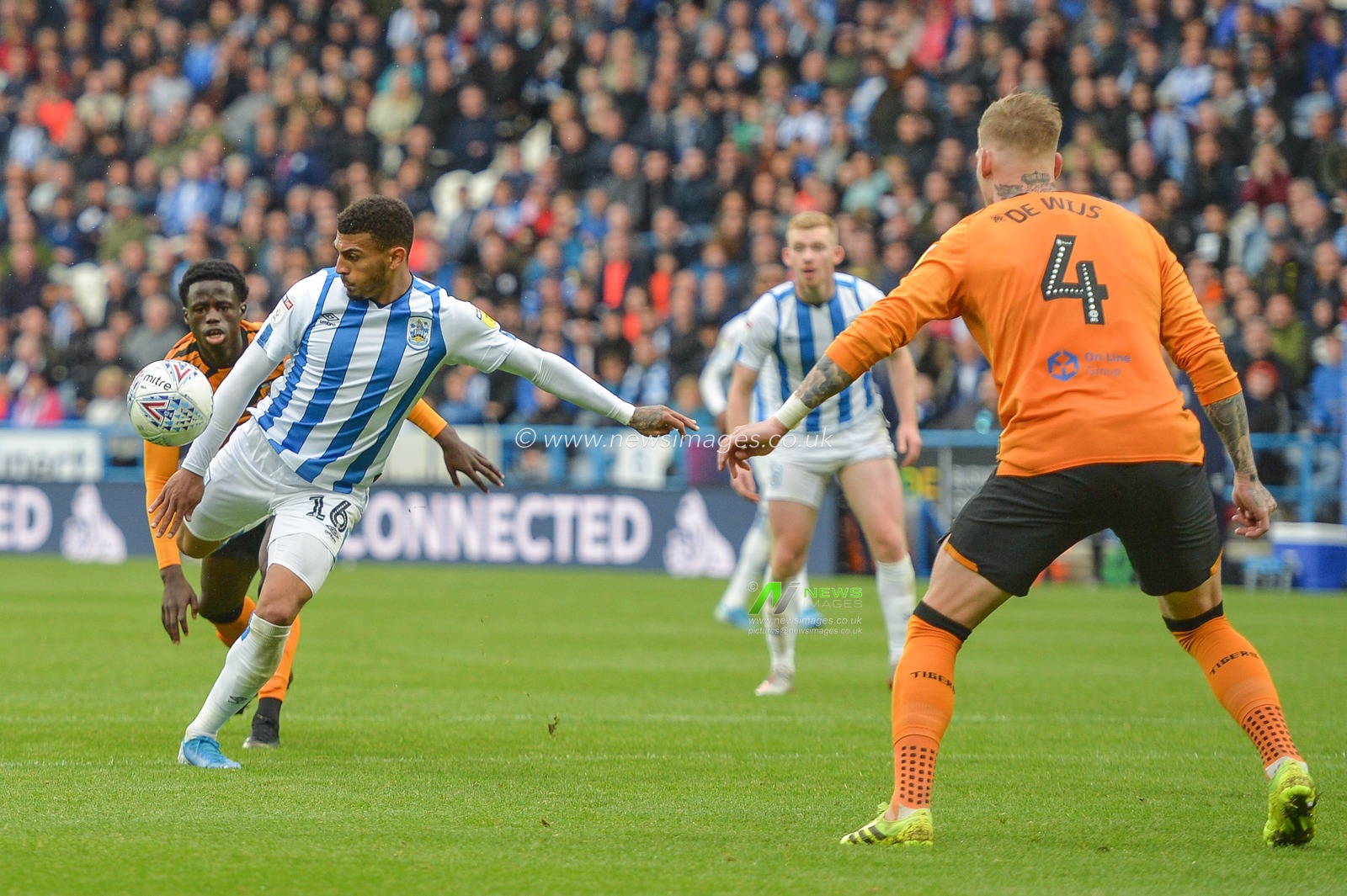 5th October 2019, John Smith's Stadium, Huddersfield, England; Sky Bet Championship, Huddersfield Town v Hull City :Karlan Grant (16) of Huddersfield Town  strikes the ball to score to make it 1-0 to Huddersfield Town 
Credit: Dean Williams/News Images