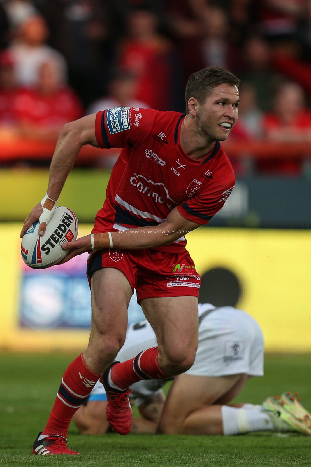 Matt Parcell #9 of Hull KR prepares to pass the ball