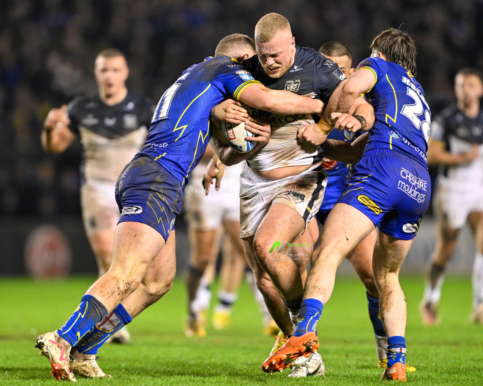 Jack Ashworth Hull FC is tackled by Adam Holroyd of Warrington Wolves and Ben Currie of Warrington Wolves, during the Betfred Super League Round 2 match Warrington Wolves vs Hull FC at Halliwell Jones Stadium, Warrington, United Kingdom, 23rd February 2024

(Photo by Cody Froggatt/News Images)