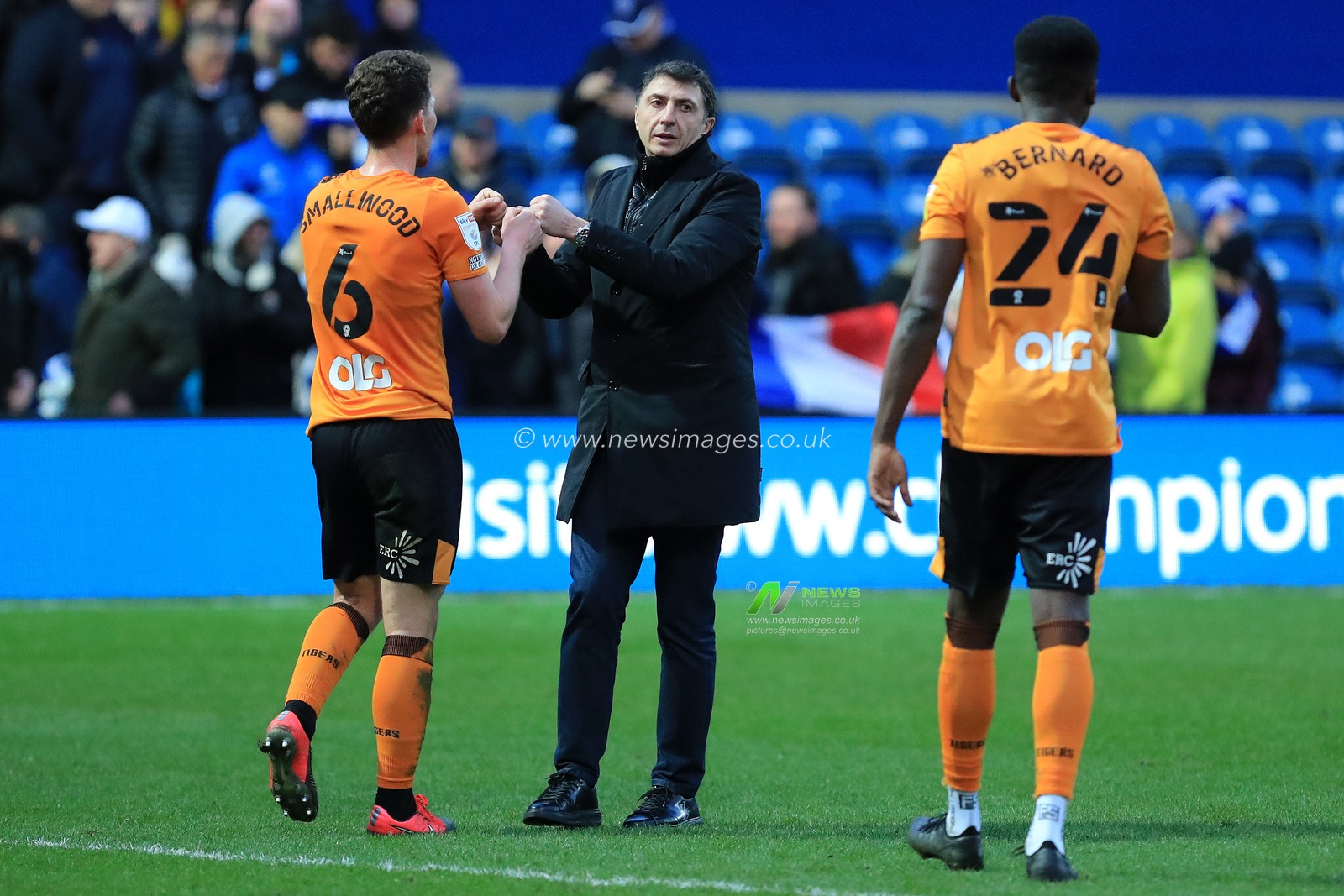Shota Arveladze manager of Hull City with Richard Smallwood #6 of Hull City and Di'Shon Bernard #24 of Hull City.