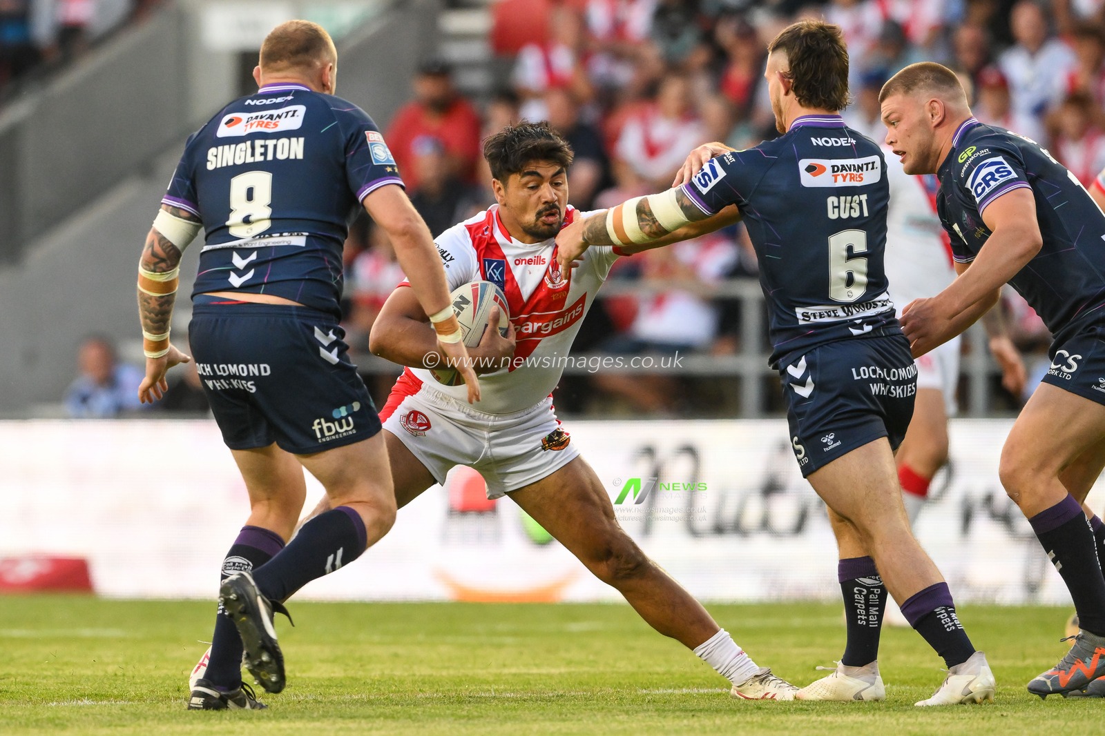 James Bell #19 of St Helensfends off Cade Cust #6 of Wigan Warriors  during the Betfred Super League Round 15 match St Helens vs Wigan Warriors at Totally Wicked Stadium, St Helens, United Kingdom, 9th June 2023

(Photo by Craig Thomas/News Images)