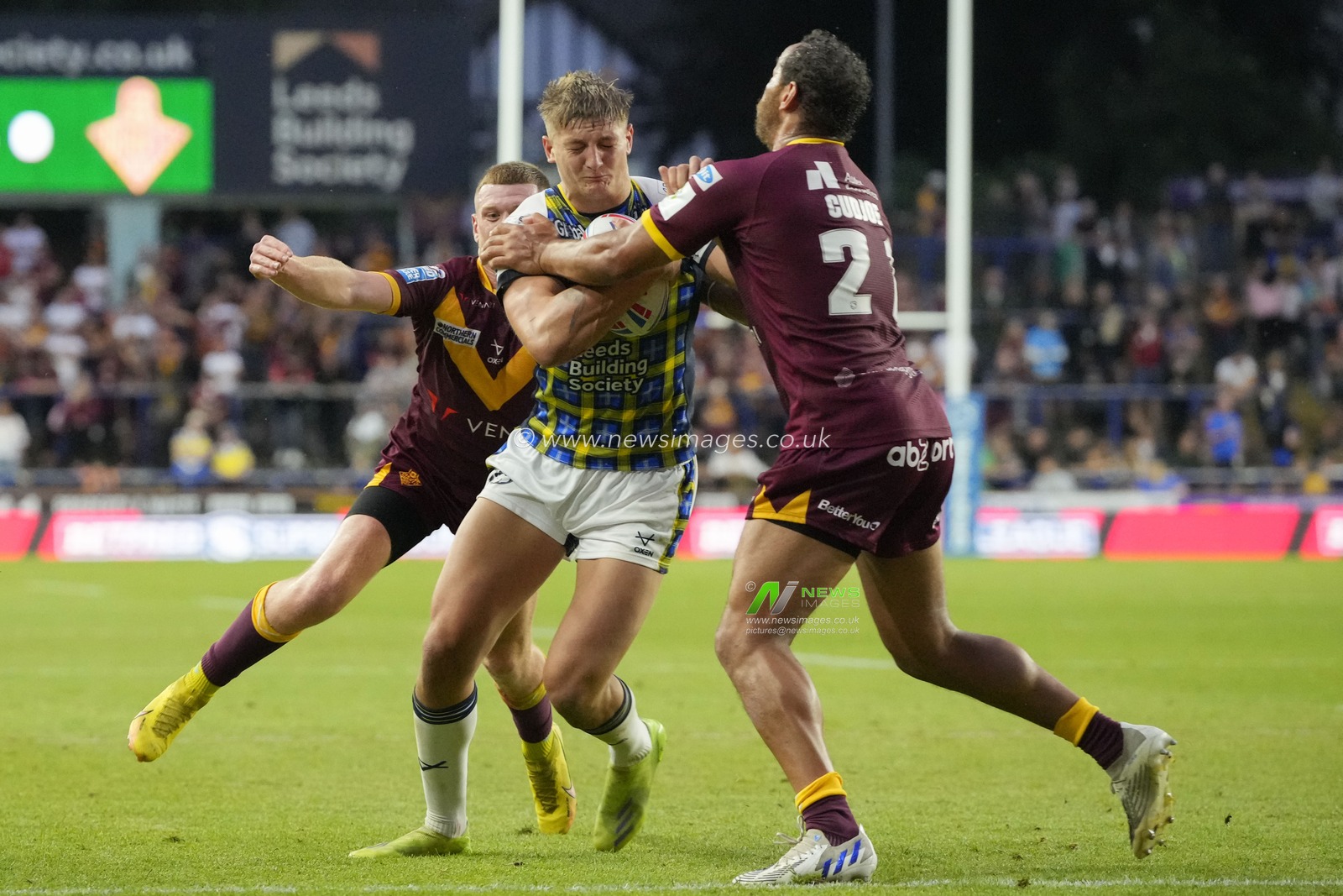 Sam Walters #22 of Leeds Rhinos runs at Leroy Cudjoe #21 of Huddersfield Giants during the Betfred Super League Round 16 match Leeds Rhinos vs Huddersfield Giants at Headingley Stadium, Leeds, United Kingdom, 23rd June 2023

(Photo by Steve Flynn/News Images)